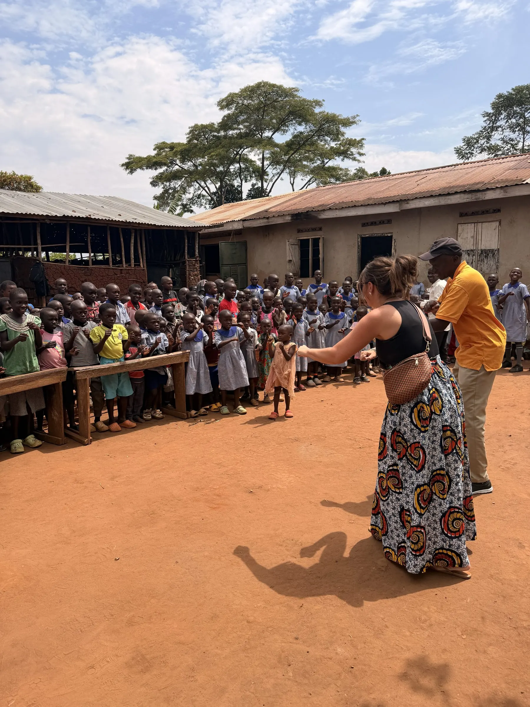 Students gathered in front of the two temporary school buildings